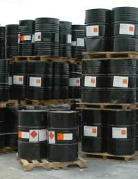 Barrels of pesticide on pallets awaiting transport