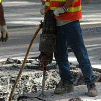 worker operating a jackhammer