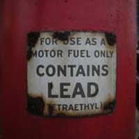 vintage lead fuel warning sign