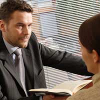 a solicitor consulting with a client