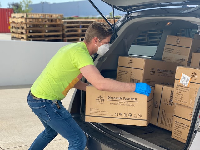 manual handling being performed on cardboard boxes