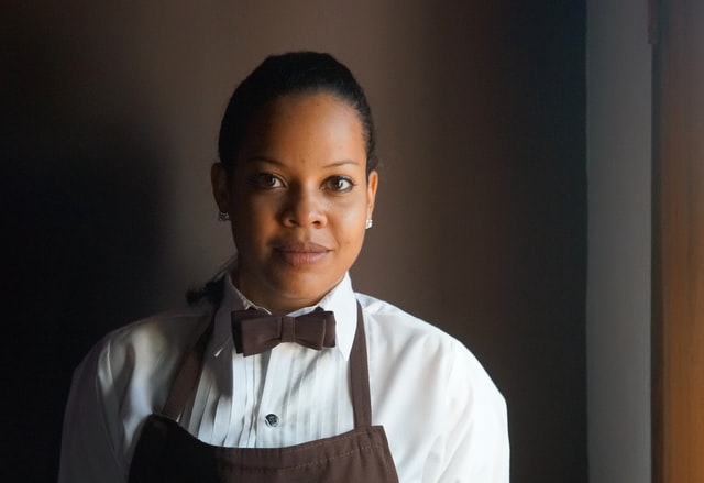 young worker in hospitality uniform